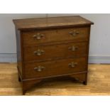 A early 20th century mahogany chest of drawers, three graduated drawers with brass pull handles,