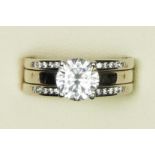 A 14ct white gold and CZ single stone ring, similarly set shoulders, O 1/2, 6.5gm