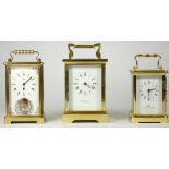 Two English and one German brass carriage clocks, having enameled dials, Roman numerals with 8 day