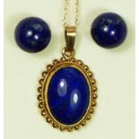 A 9ct gold mounted oval lapis lazuli pendant, 15 x 12mm, chain and a a pair of lapis ear studs