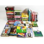 A collection of sporting DVDs and books, mainly themed around Manchester United and Cycling, to