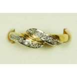 A 14ct gold and diamond twist ring, P, 2.3gm