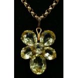 A Victorian 9ct gold mount flower head pendant, composed of mixed cut pear shape and oval