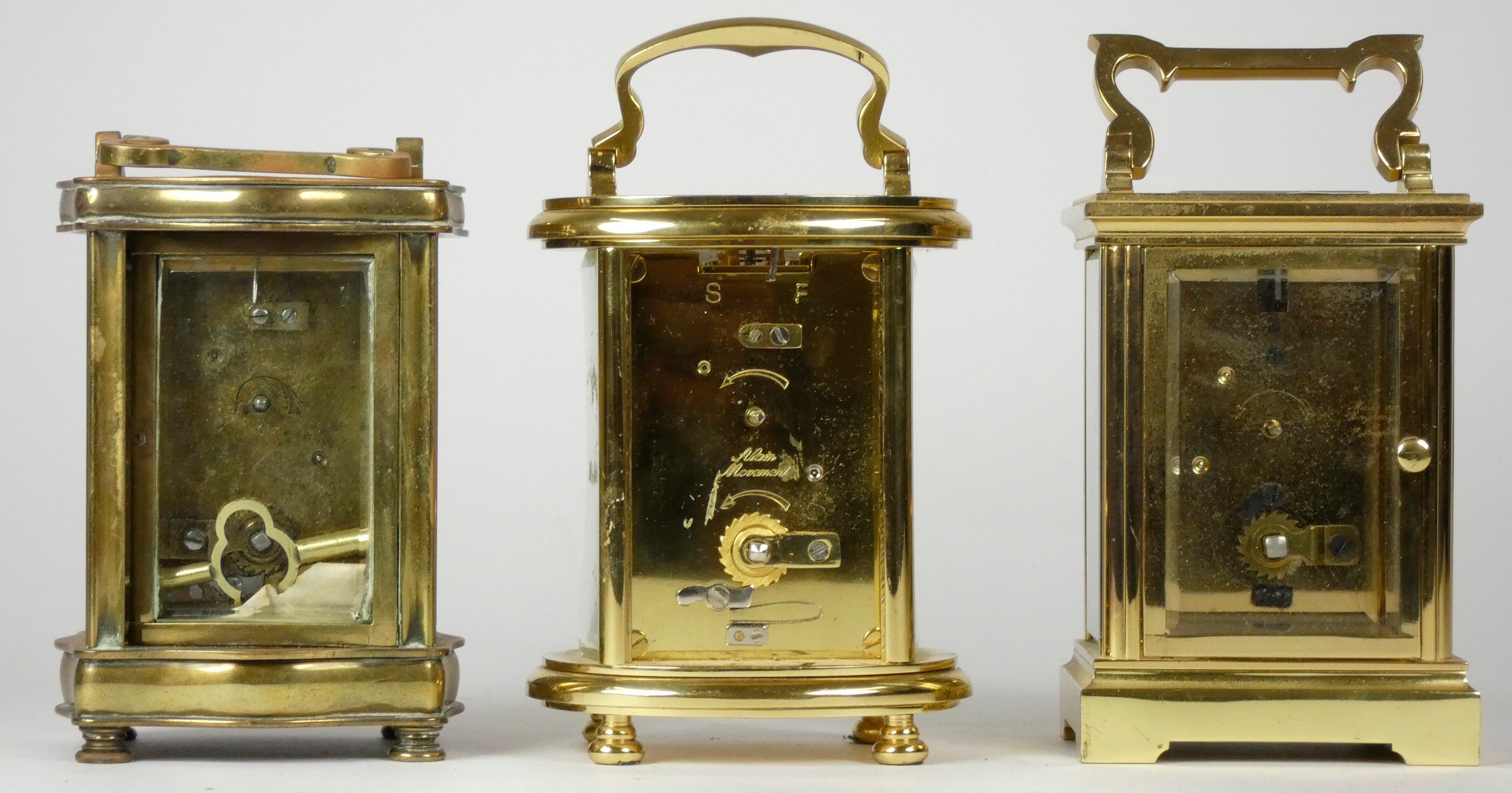 Three mid 20th Century brass carriage clocks, white enameled dials with Roman numerals, beveled edge - Image 3 of 3