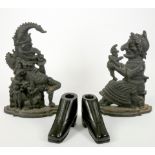 A pair of cast metal flatback figures, in the form of Punch and Judy, together with a pair of