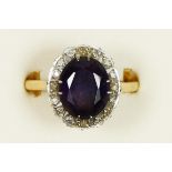 A 9ct gold, amethyst, 12 x 9mm, and diamond cluster ring, W, 4.6gm