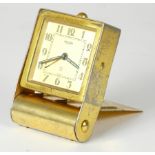 A 1930s Art Deco Jaeger traveling alarm clock, folding case with swiss movement. 8cm long.