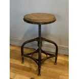 An industrial rotary workshop stool, having adjustable swivel pine disc seat on four curved steel