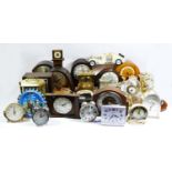 A large collection of mid 20th century and later mantle clocks and barometers, having manual &