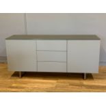 A modern Danetti sideboard, finished in eve matt grey and frosted glass top, having three central