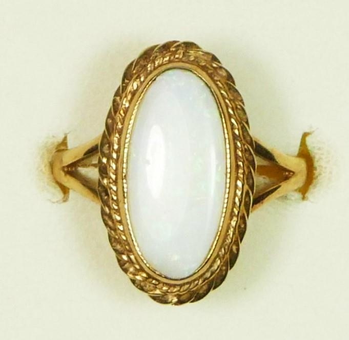 A 9ct gold opal dress ring, 15 x 7mm, Edinburgh 1989, M, 3.2gm