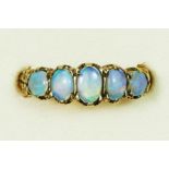 A 9ct gold opal five stone diamond ring, carved claw set with graduated stones, Q, 3gm