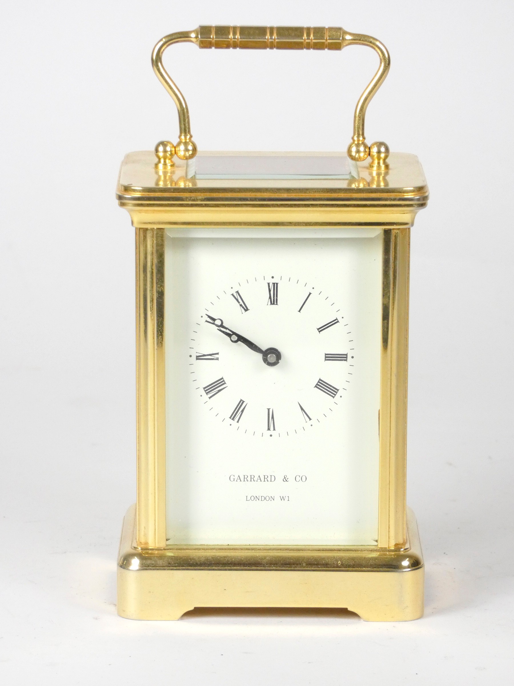 An English 8 day carriage clock, brass cased, bevel edged glass panels with enameled dial and - Image 2 of 4