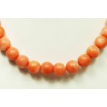 A coral bead necklace, 100 - 8mm, length 53cm