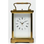 Matthew Norman, London, a brass cased repeating and striking carriage clock, white enamel dial,