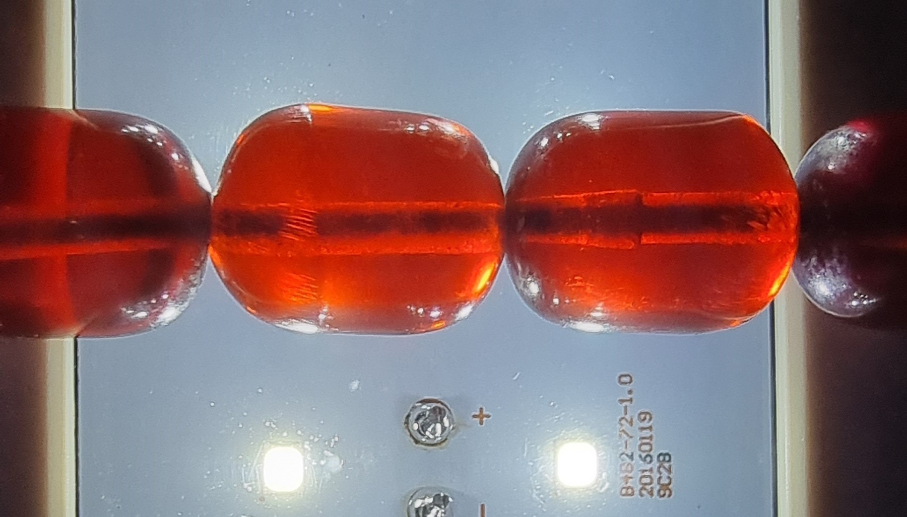 A cherry red amber bead necklace, 63gm, the largest bead 17 x 12mm - Image 5 of 6