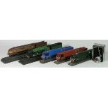 Three hand painted OO scale cold cast models of locos and tenders on rails, including three West