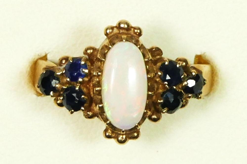 A 9ct gold, opal and sapphire dress ring, P, 3.8gm