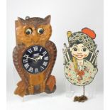 A 1950s novelty wall clock, in the form of a owl, having mechanical movement with 'moving eyes',