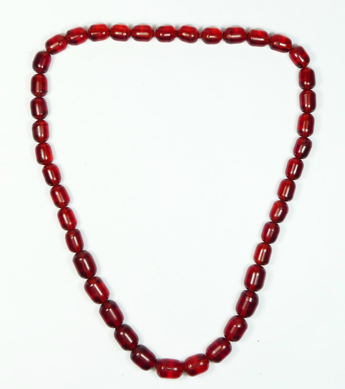 A cherry red amber bead necklace, 63gm, the largest bead 17 x 12mm - Image 2 of 6