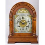 An early 20th century Asonia oak cased mantel clock, silvered chapter ring, dial with gilt