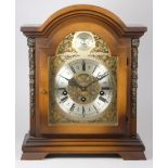 A mid 20th century bracket clock, filigree dial with appliques Tempus Fugit, silvered dial with