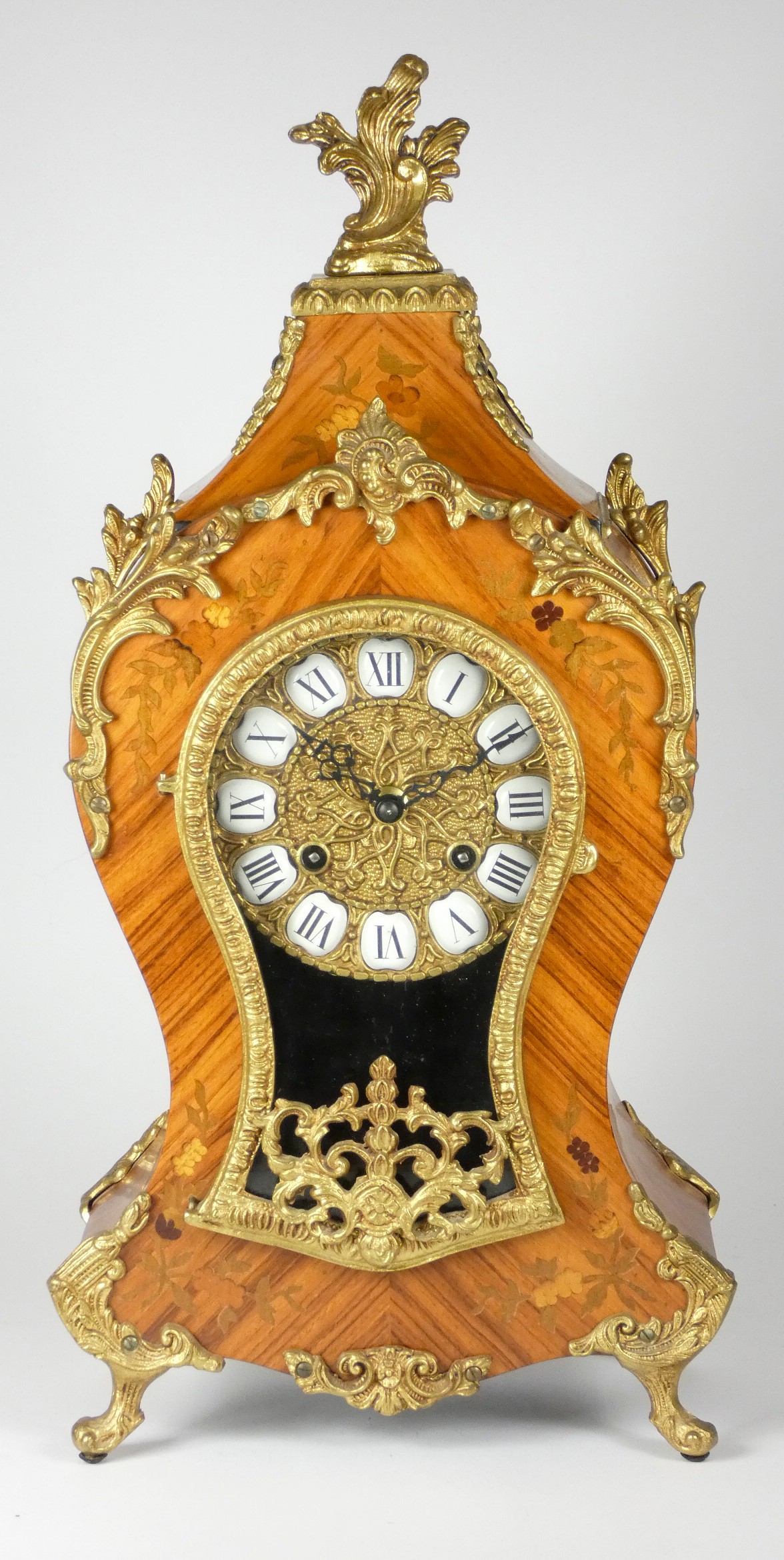 A late 19th century Louis XVI style Boule mantel clock, inlaid walnut case with applied embossed
