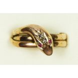 A Victorian rose gold, rose cut diamond and red paste coiled snake ring, W, 5.6gm