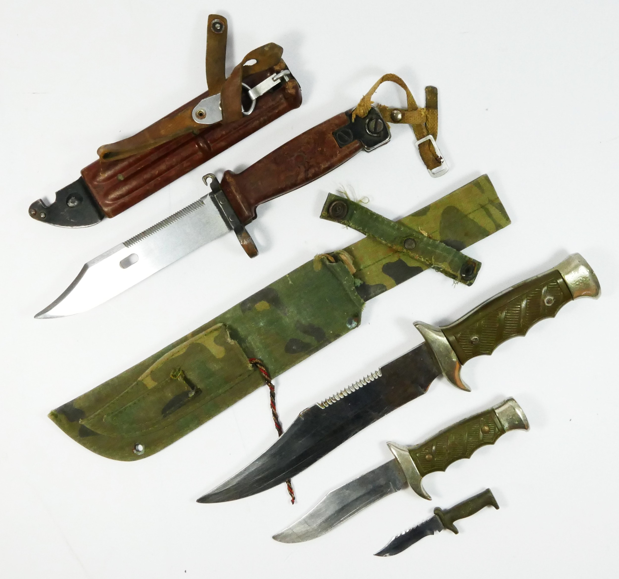 An AK47 assault rifle bayonet, numbered 499 with 15cm blade, scabbard and belt attachment,