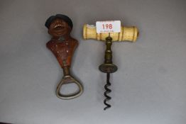 An antique brass and bone corkscrew and similar