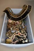 A selection of costume jewellery including brooches, rings, strings of beads, rolled gold glass