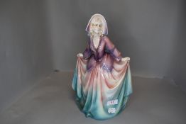 An art deco figurine by Katzhutte of a lady in dress