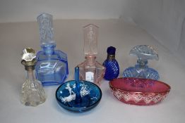 A selection of coloured glassware including perfume bottles, one with HM collar, ring stand and