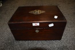 A vintage wooden writers compendium having mahogany case and mother of pearl inlay