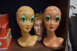 Three vintage mannequin heads including two mid century styled