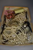 A selection of costume jewellery including watches, simulated pearl necklaces, etc