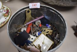 A selection of curios and trinkets including cap badges