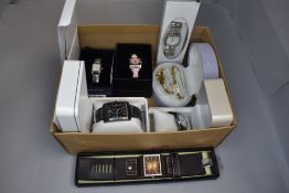 Seven assorted cased fashion wrist watches