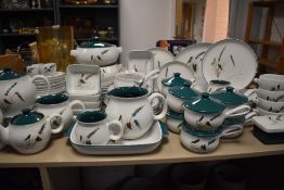 A large part dinner and dessert service by Denby in the Green Wheat design