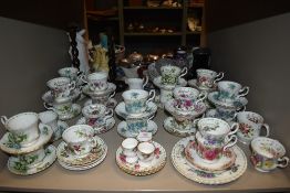 A selection of tea cups and saucers by Royal Albert in various designs