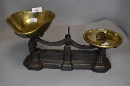 A set of vintage cast iron and brass pan kitchen scales