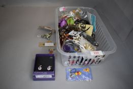 A selection of modern costume jewellery including earrings, phone charms etc