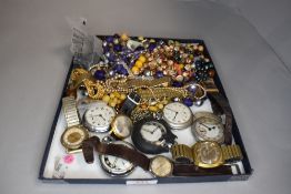 A selection of costume jewellery including, pocket watches, wrist watches, strings of beads etc