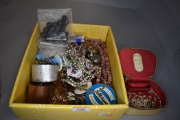 A selection of costume jewellery including vintage beads bangles and some loose and a coin