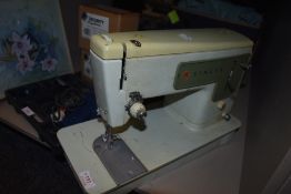A vintage Singer sewing machine, model number 449.
