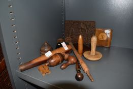 A selection of treen wood items including Burmese style plaque and football case