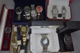 A tray of assorted fashion watches, several in original cases including Alpine Swiss, Zeon, Omax