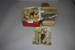 A selection of collectable postcards coins currency and Victorian scraps