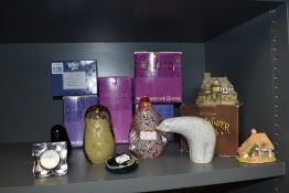 A selection of figural paper weights by Wedgwood and Lilliput lane model houses