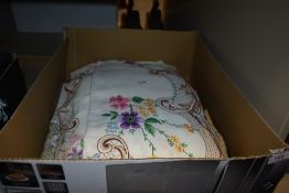 A selection of vintage table linen including some beautifully embroidered and colourful examples.